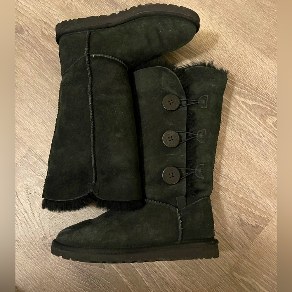 Tall, black Ugg boots with buttons